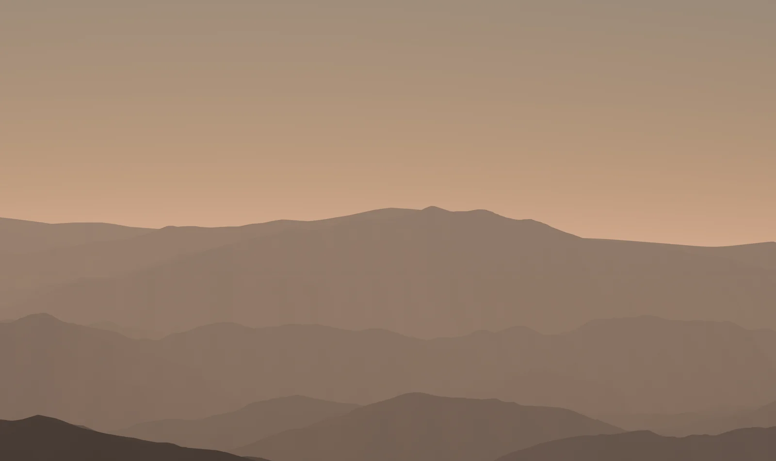 Ridges in warm golden haze, fading into a peach-colored sky.