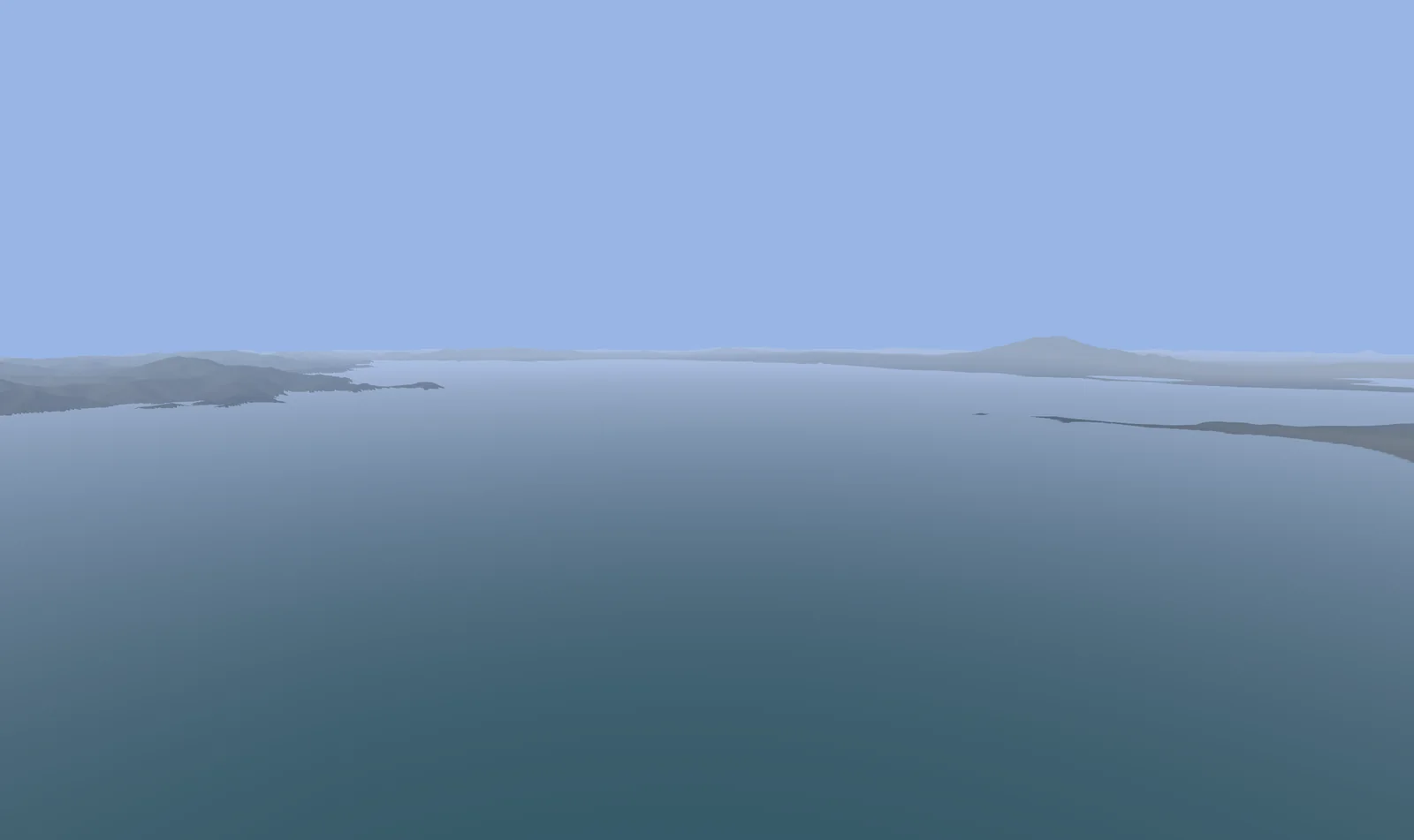 Lake Van stretching to a distant shore with a volcano on the horizon.